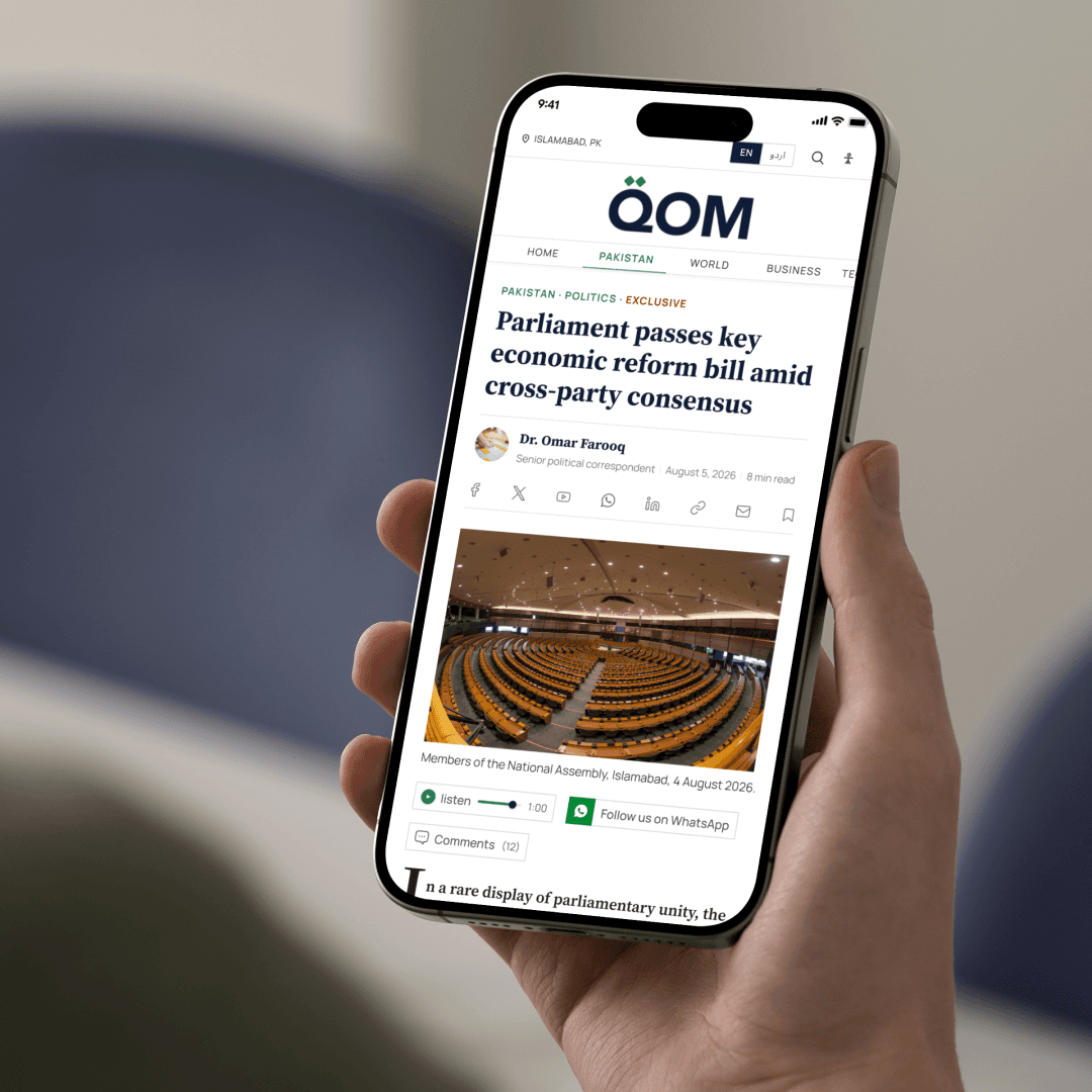 QOM News mobile article experience displayed on a smartphone