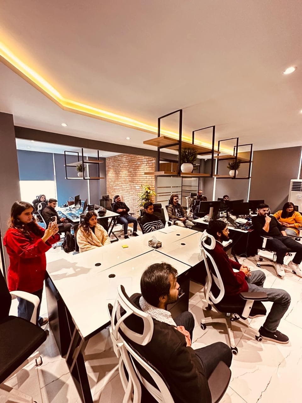 Code Huddle team collaborating in the Islamabad workspace
